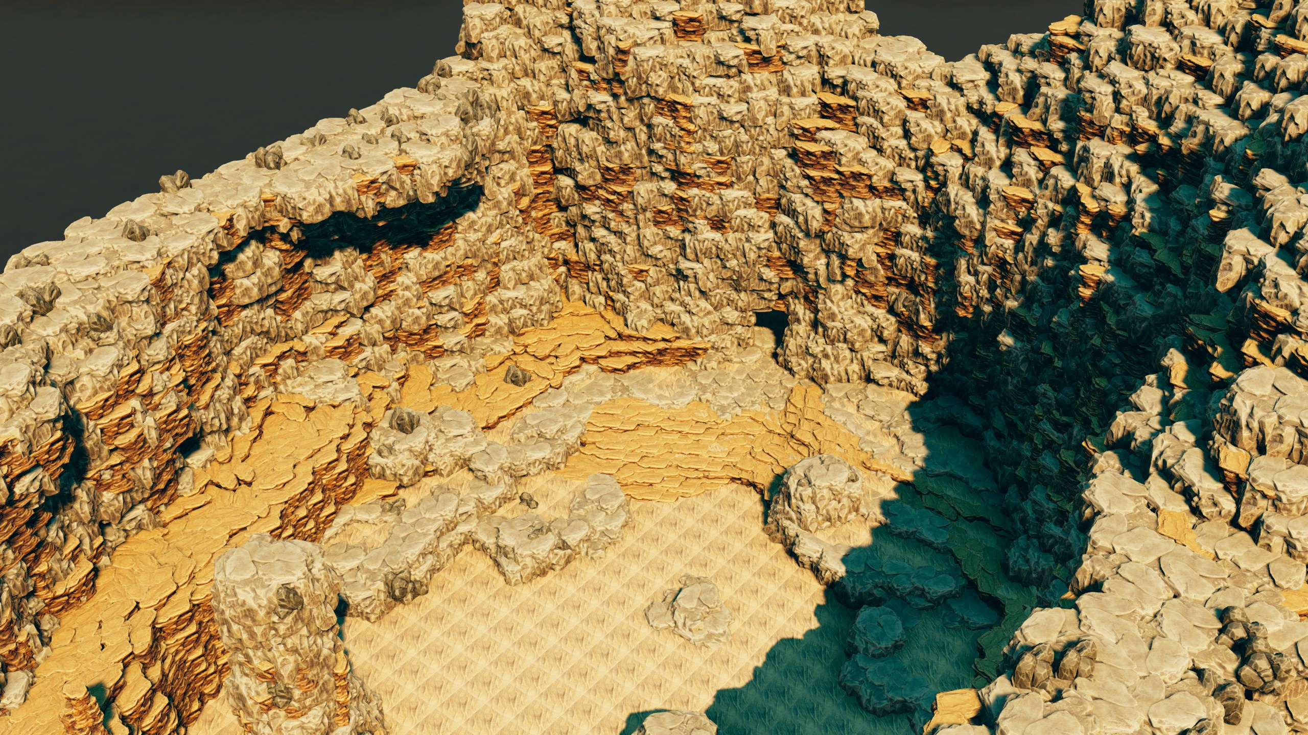 A wide sandy basin ringed by eroded canyon walls