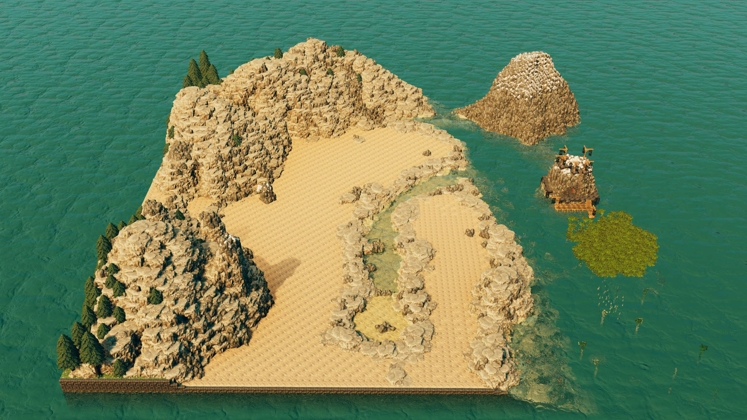 Aerial overview of the sandy island cove with rocky cliffs and a small outcrop