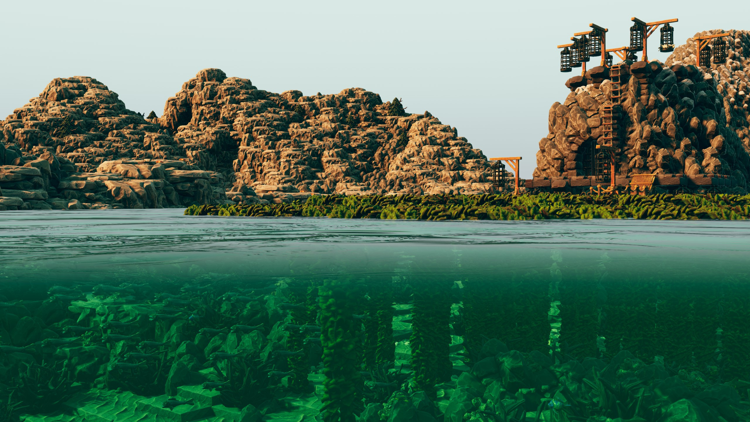 Rocky sea stacks and a cliffside lookout above a seaweed-filled waterline