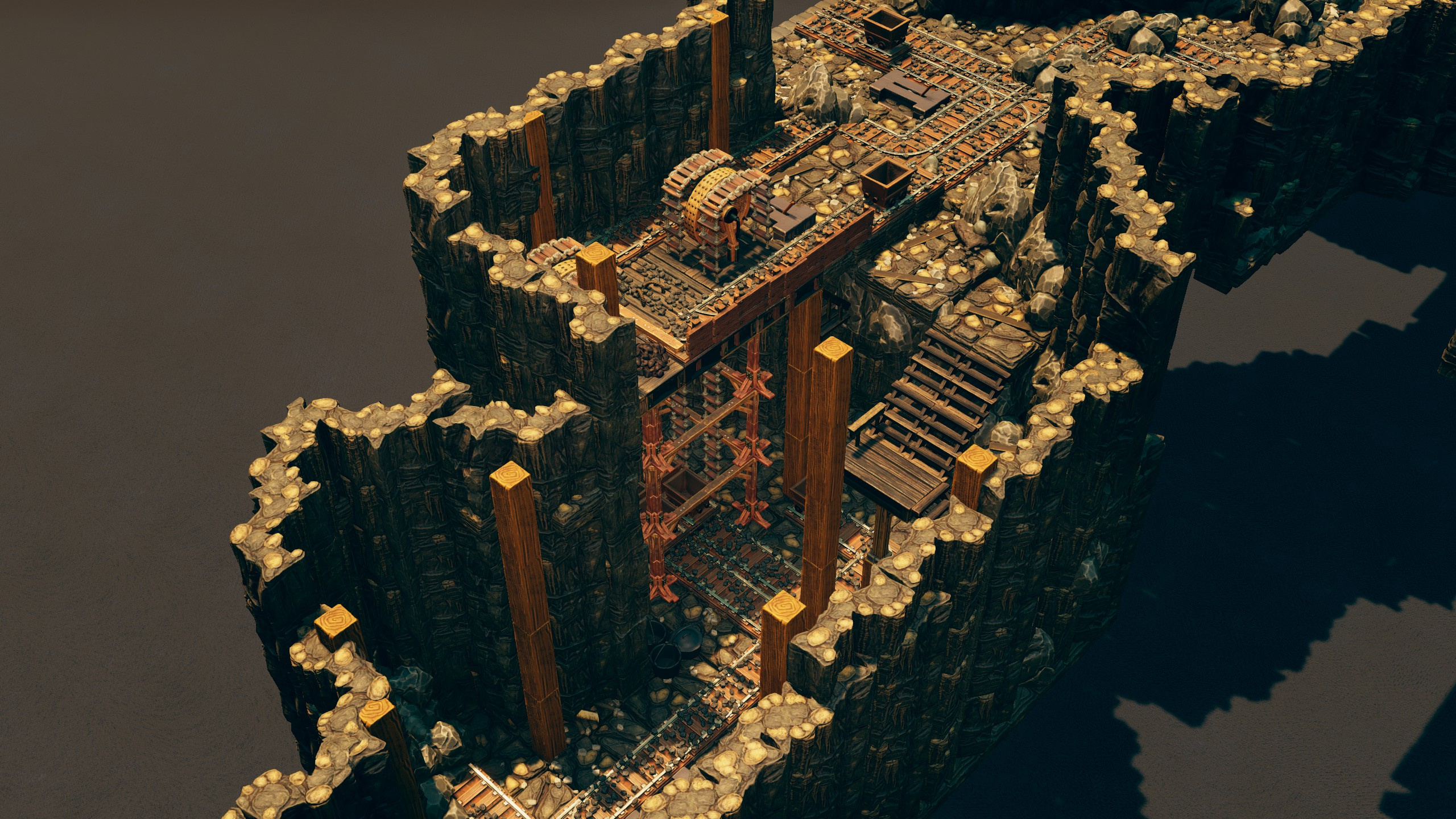A wooden mine lift and staircase descending a deep mine shaft