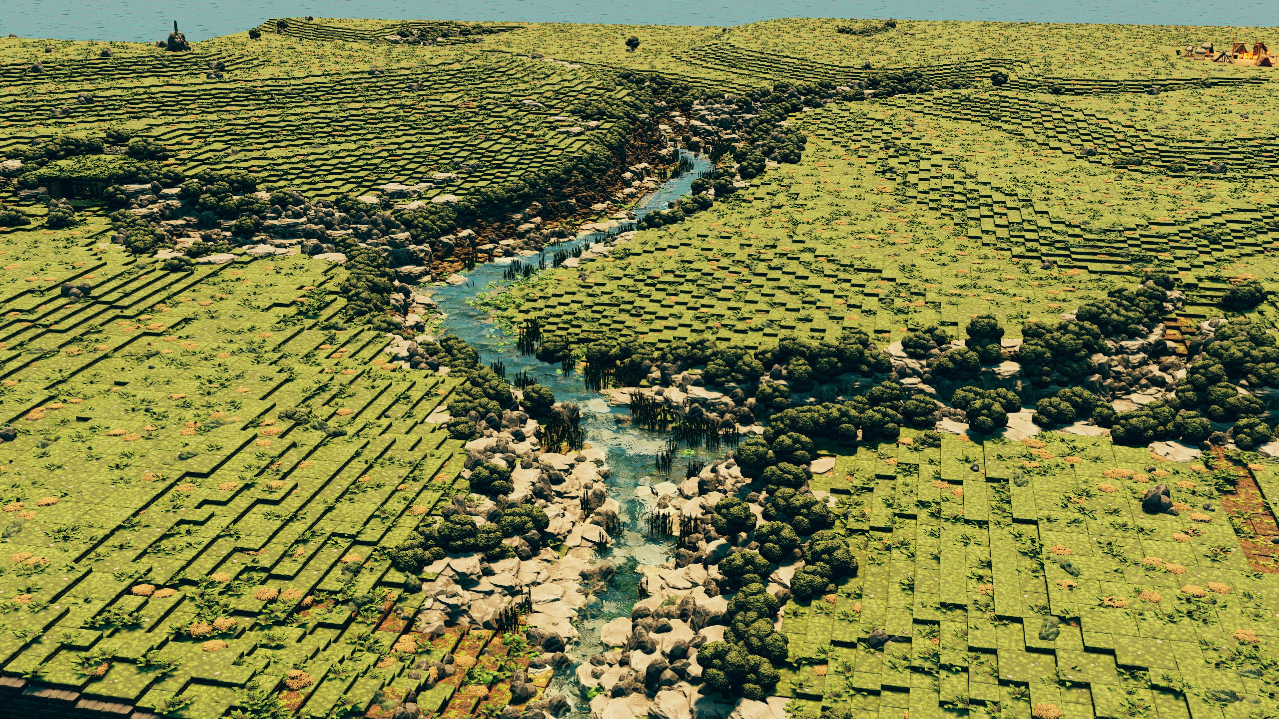 A rocky river ravine cutting through the grasslands